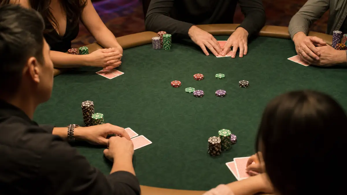 Several players have limped into the same hand, so multiple small stacks of chips sit pushed forward around the green felt in a cheap multiway pot